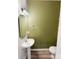 Cozy half bath featuring a pedestal sink, modern fixtures, and neutral decor at 4105 Galloway Park Dr, Charlotte, NC 28262