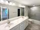Bathroom featuring double sinks, large mirror and glass enclosed tile shower at 4105 Galloway Park Dr, Charlotte, NC 28262