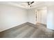Bedroom features carpeted floors, ceiling fan and a door into the bathroom at 4105 Galloway Park Dr, Charlotte, NC 28262