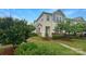 Exterior view of a two-story townhome with well-maintained lawn and landscaping at 4105 Galloway Park Dr, Charlotte, NC 28262