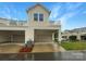 Townhome featuring garage parking, carport, and upper-level balcony at 4105 Galloway Park Dr, Charlotte, NC 28262