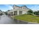 Inviting two-story home featuring attached carport, balcony, green lawn, and charming landscaping at 4105 Galloway Park Dr, Charlotte, NC 28262