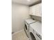 Laundry room with white cabinets and appliances including a washer and dryer at 4105 Galloway Park Dr, Charlotte, NC 28262