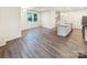 Bright living room with hardwood floors, large windows, and an island with granite countertop at 4105 Galloway Park Dr, Charlotte, NC 28262