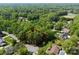 Aerial view of property surrounded by mature trees in a residential neighborhood at 4417 Walter Nelson Rd, Mint Hill, NC 28227
