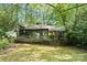 Charming home featuring an expansive deck overlooking the serene, private backyard at 4417 Walter Nelson Rd, Mint Hill, NC 28227