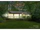 Charming home featuring an expansive deck overlooking the serene, private backyard at 4417 Walter Nelson Rd, Mint Hill, NC 28227