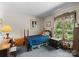 Comfortable bedroom featuring a twin bed, wooden furniture, and a bright window view at 4417 Walter Nelson Rd, Mint Hill, NC 28227