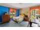 Traditional bedroom showcasing a bed, vintage furniture, and windows overlooking the outdoor scenery at 4417 Walter Nelson Rd, Mint Hill, NC 28227
