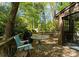 Inviting backyard deck with outdoor seating, ideal for enjoying the serene wooded surroundings at 4417 Walter Nelson Rd, Mint Hill, NC 28227