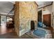 Entryway featuring a stone wall, hardwood floors and a view to the Gathering room at 4417 Walter Nelson Rd, Mint Hill, NC 28227