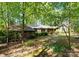 Charming wood and stone home with mature landscaping creating a private, wooded setting at 4417 Walter Nelson Rd, Mint Hill, NC 28227
