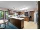 This retro kitchen features wood cabinets, laminate countertops and a dining area at 4417 Walter Nelson Rd, Mint Hill, NC 28227