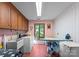 Functional laundry room equipped with a washer, dryer, sink, and ironing station at 4417 Walter Nelson Rd, Mint Hill, NC 28227