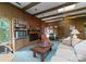 Cozy living room highlighting a fireplace, built-in bookshelves, and comfortable sofa at 4417 Walter Nelson Rd, Mint Hill, NC 28227