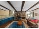 Cozy living room featuring a stone fireplace, wood beams, and hardwood floors at 4417 Walter Nelson Rd, Mint Hill, NC 28227