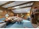 Bright living room with beamed ceilings, skylights and comfortable seating creates a welcoming atmosphere at 4417 Walter Nelson Rd, Mint Hill, NC 28227