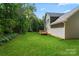 Expansive backyard featuring lush lawn and a wooden deck for outdoor enjoyment at 4541 Kings Ct, Hickory, NC 28602