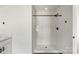 Modern bathroom with a fully tiled shower stall and sleek, black hardware at 4541 Kings Ct, Hickory, NC 28602