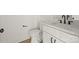 Cozy powder room featuring modern toilet and vanity at 4541 Kings Ct, Hickory, NC 28602
