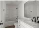 Clean bathroom featuring an updated vanity, tub, and shower with neutral finishes at 4541 Kings Ct, Hickory, NC 28602