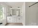 Contemporary bathroom with a large mirror, dual sinks and plenty of storage space at 4541 Kings Ct, Hickory, NC 28602