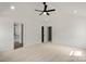 Spacious bedroom with ceiling fan and two closets at 4541 Kings Ct, Hickory, NC 28602