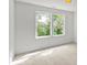 Bedroom with two windows and neutral carpet at 4541 Kings Ct, Hickory, NC 28602