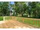 A wood deck overlooks a well manicured yard, great for outdoor entertaining at 4541 Kings Ct, Hickory, NC 28602