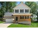 Two-story home with a covered front porch, garage and neatly kept lawn at 4541 Kings Ct, Hickory, NC 28602