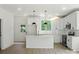 Bright kitchen with white cabinets, stainless steel appliances, and a kitchen island at 4541 Kings Ct, Hickory, NC 28602