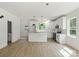 Stylish white kitchen with modern pendant lighting and stainless steel appliances at 4541 Kings Ct, Hickory, NC 28602