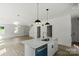 Bright kitchen island with stainless steel appliances and hardwood floors at 4541 Kings Ct, Hickory, NC 28602