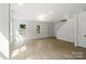 Bright open living space features wood floors and an entryway to the staircase at 4541 Kings Ct, Hickory, NC 28602