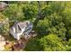 Aerial view of a home featuring a well-maintained yard, mature trees, and outdoor living areas at 4622 Cotton Creek Dr, Charlotte, NC 28226