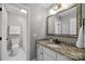 Neutral tone bathroom featuring a granite countertop vanity and walk in shower at 4622 Cotton Creek Dr, Charlotte, NC 28226