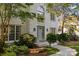 Lovely white brick home featuring an elegant gray front door and well-manicured landscaping at 4622 Cotton Creek Dr, Charlotte, NC 28226