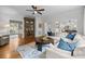 Cozy living room showcasing hardwood floors, neutral colors, and a decorative wood cabinet at 4622 Cotton Creek Dr, Charlotte, NC 28226
