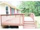 Inviting back deck with painted railings, offering a great space for outdoor relaxation and gatherings at 517 N Pine Ln, Wadesboro, NC 28170
