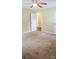 Neutral bedroom featuring a lighted ceiling fan, soft carpeting, and easy access to other rooms at 517 N Pine Ln, Wadesboro, NC 28170