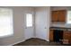 Bright eating area featuring a door to the outside, light-colored walls, and sleek countertops at 517 N Pine Ln, Wadesboro, NC 28170