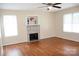 Inviting living room with hardwood floors, neutral walls, fireplace and natural light at 517 N Pine Ln, Wadesboro, NC 28170