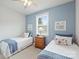 Cozy bedroom featuring two twin beds, a dresser, and natural lighting at 528 Sandbar Pt, Clover, SC 29710