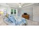 Bedroom with trey ceilings, ceiling fan, two windows, and a wooden dresser at 528 Sandbar Pt, Clover, SC 29710