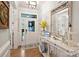 Bright entryway with hardwood floors, stylish console table, and a welcoming ambiance at 528 Sandbar Pt, Clover, SC 29710