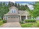 Charming two-story home with a well-manicured lawn and a two-car garage, exuding curb appeal at 528 Sandbar Pt, Clover, SC 29710