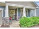 Inviting front porch with stone accents, comfortable seating, and a welcoming entrance at 528 Sandbar Pt, Clover, SC 29710