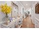 Inviting hallway with hardwood floors, stylish console table, and a glimpse into the living spaces at 528 Sandbar Pt, Clover, SC 29710