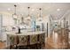 Modern kitchen with stainless steel appliances, granite counters, and island with barstool seating at 528 Sandbar Pt, Clover, SC 29710