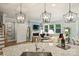 Open-concept kitchen looking to living room with fireplace, large windows and comfortable seating at 528 Sandbar Pt, Clover, SC 29710